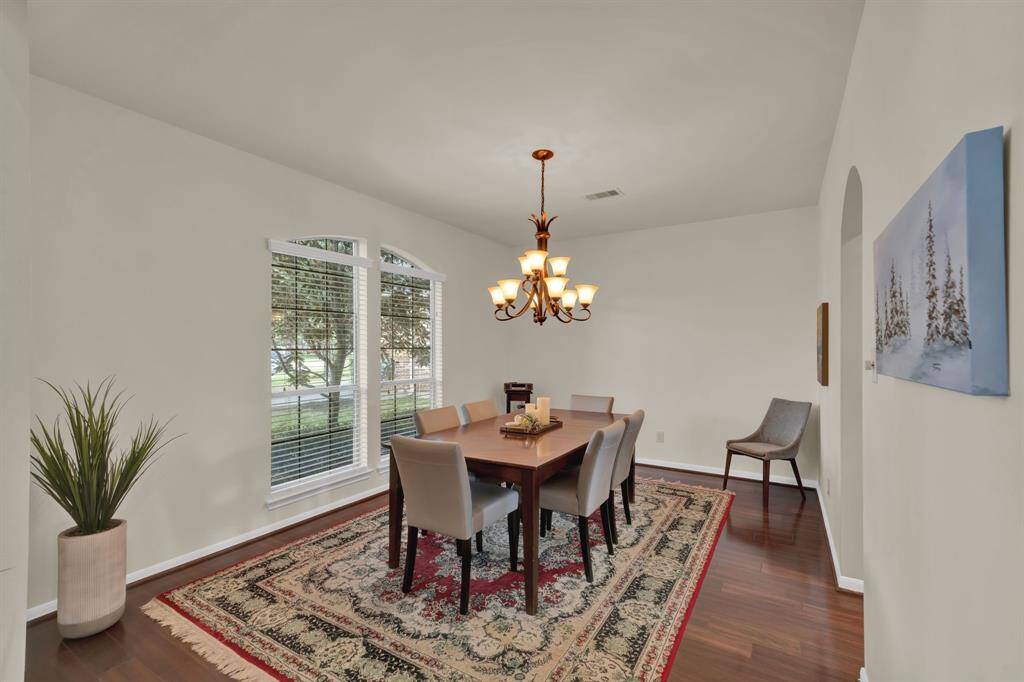 Formal dining to the left opens right to the kitchen and is perfect for dinners or entertaining!