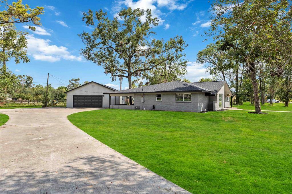Long driveway with detached garage
