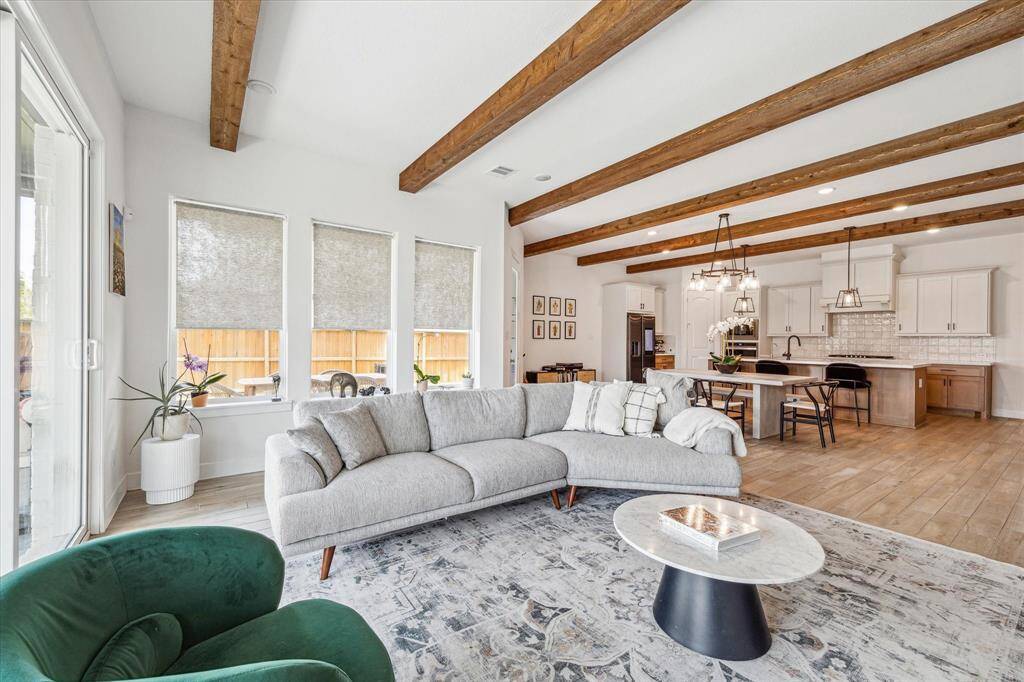 expansive primary bedroom overlooks private back lawn