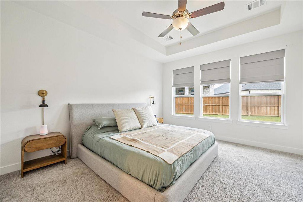 Tray ceiling in primary bedroom