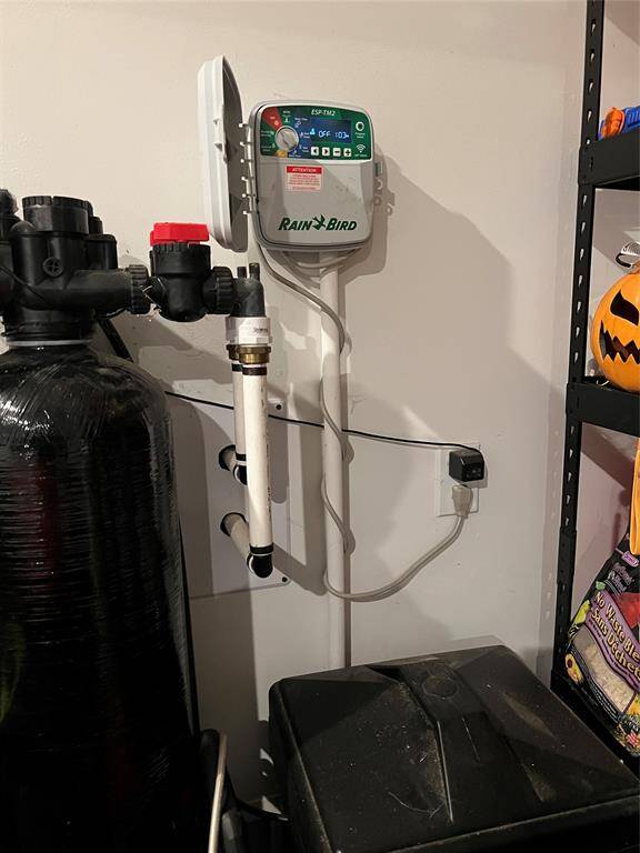 whole home UNITED water softener and irrigation control in garage