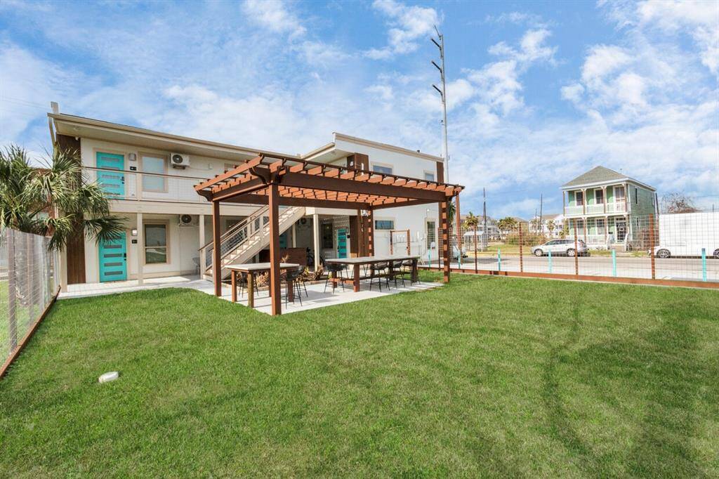 There is a fantastic gated, fully fenced in yard perfect for bbq, outdoor gatherings, and your fury friends.