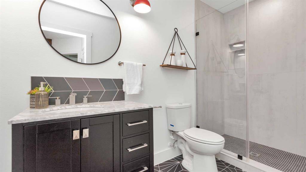 The secondary bathroom with absolutely stunning tile work.