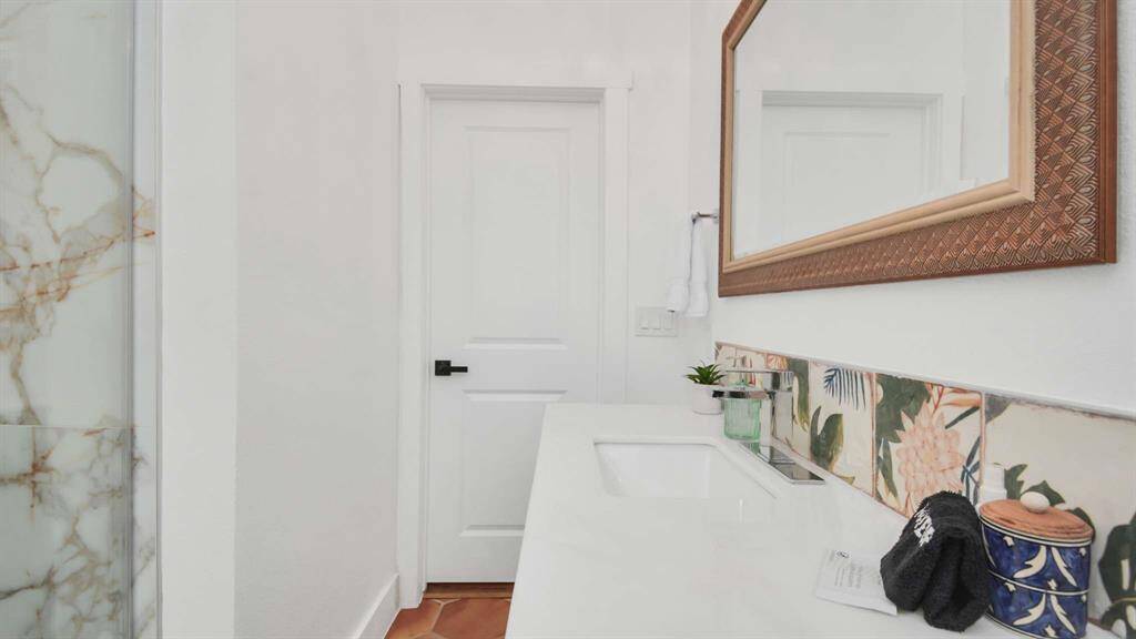 The secondary bath with a large custom shower.