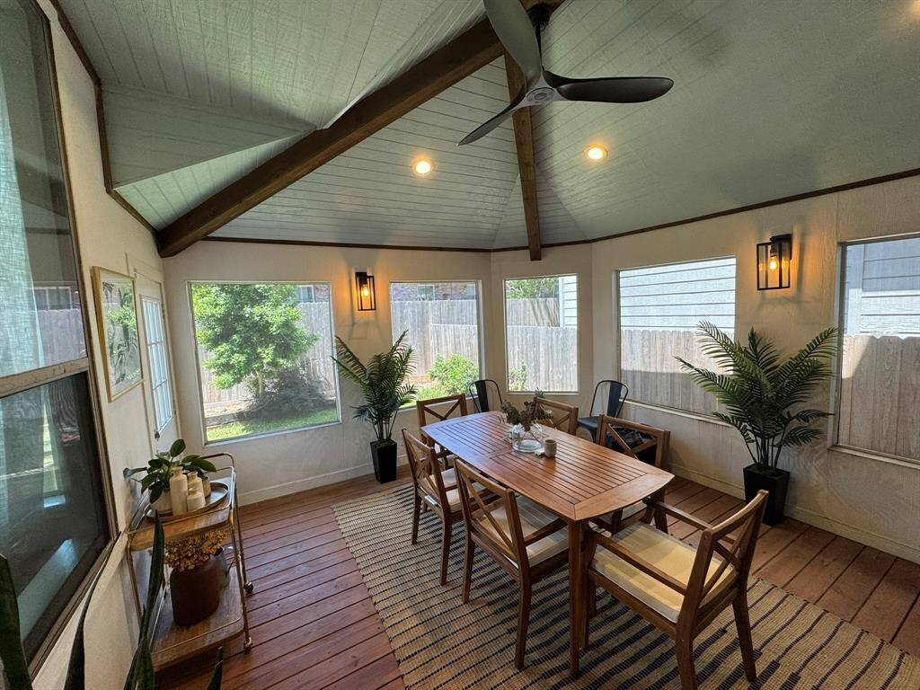 View of screened in porch towards backyard