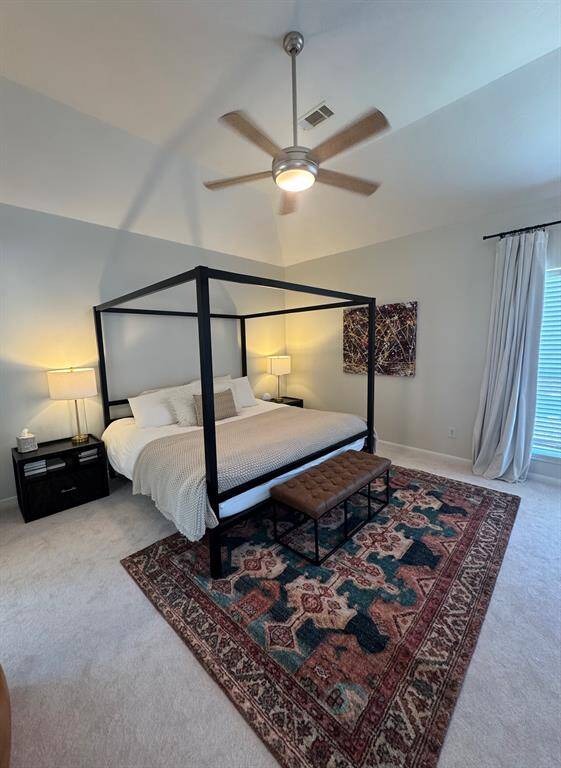 Spacious 2nd floor primary with windows overlooking backyard