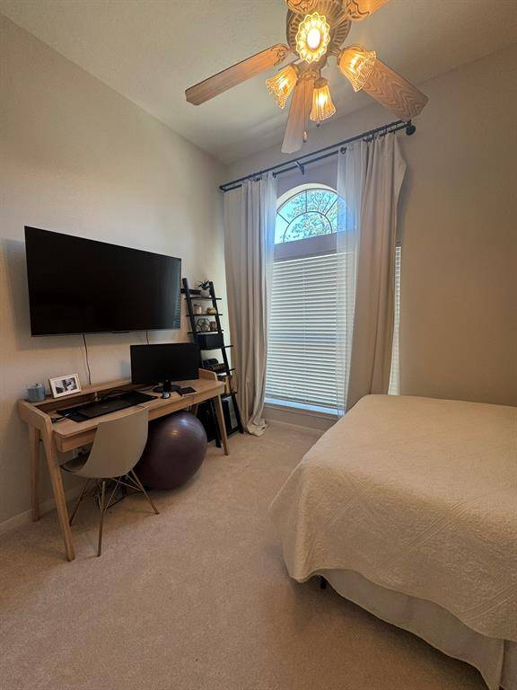 Secondary bedroom with space for desk and large windows