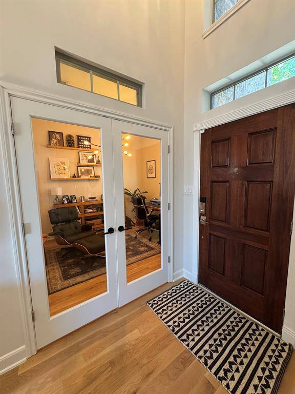 Private study with glass doors off entry