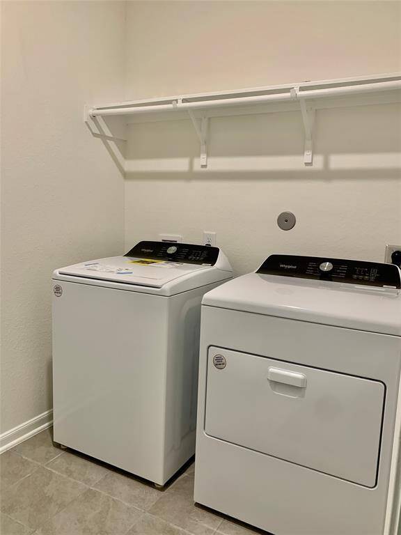Utility room with washer/dryer included