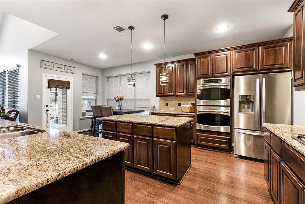 This kitchen offers an abundance of cabinet space and generous countertops—providing all the room you’ll ever need (and want!) for storage, meal prep, and entertaining. You'll love the amazing lighting, from recessed lights and stylish drop pendant fixtures to the natural light that fills the space. Plus, the center island not only adds extra prep space but also includes additional built-in storage.