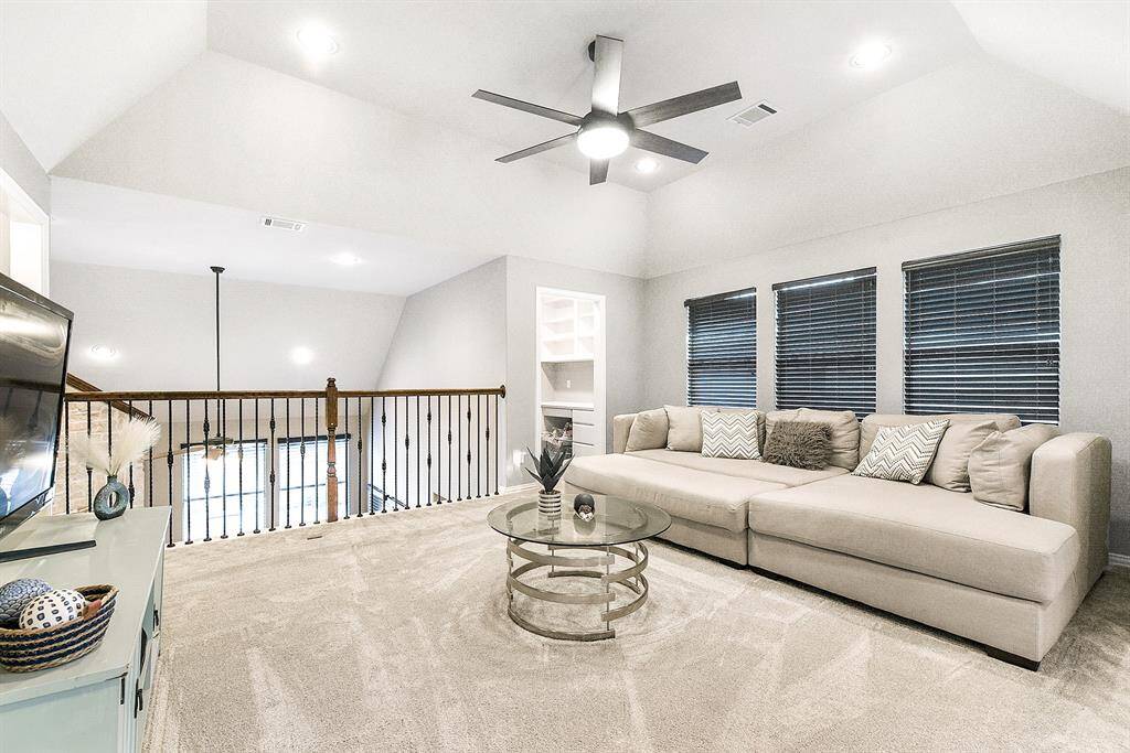 The large game room offers plenty of space for entertainment and activities, providing a versatile area for fun and relaxation. Whether it's for games, movies, or lounging, this room offers endless possibilities.