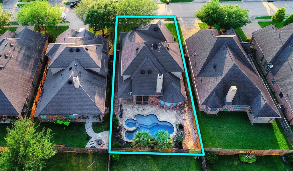 A captivating view showcases the large saltwater pool and spa, creating a serene and inviting outdoor retreat. The sparkling water and luxurious spa area provide the perfect setting for relaxation and entertainment, offering a private oasis right in your own backyard.