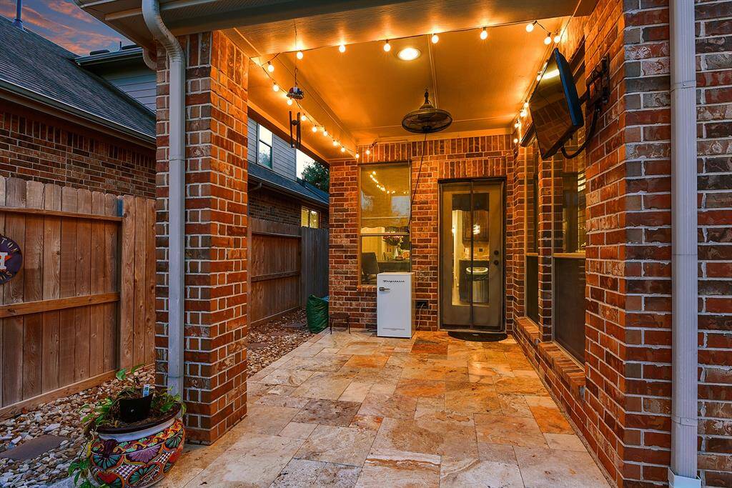 The amazing covered patio offers easy access to the indoors, making it perfect for sunset grilling nights! It's the ideal setup for preparing meals while enjoying the fresh air—seamlessly blending indoor comfort with outdoor living.