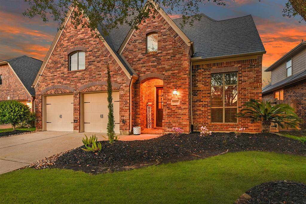 This home features all-brick construction on all four sides with a charming brick elevation, offering a classic  and cozy style. A double-wide driveway leads to a spacious two-car garage, providing plenty of parking and convenience.