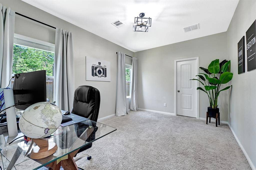 back room could be used as a bedroom or guest room with personal full bathroom