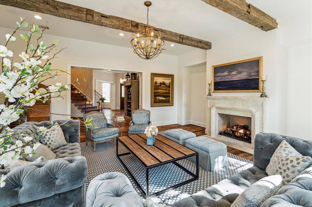 Beautiful view from living room into foyer. Gorgeous reclaimed hardwood flooring extends from living room throughout living areas & into bedrooms.