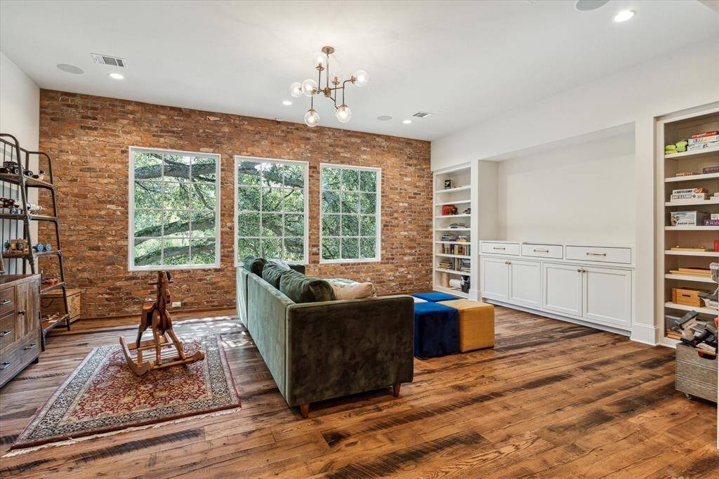 Closer view of custom cabinetry with abundant storage & plenty of room for large television.