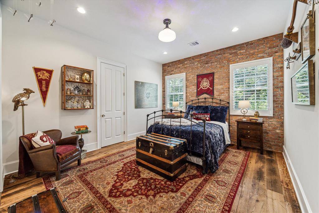 One of four large secondary bedrooms, all with large closets, recessed lighting & large windows with plantation shutters.