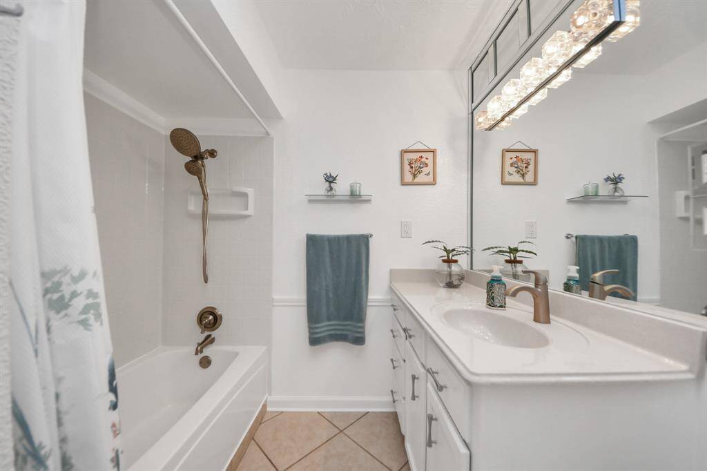 Secondary bath with a skylight, exhaust vent, heat light.