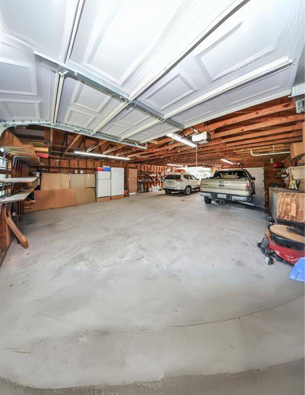 The detached 4+ car garage/workshop is a true gem—vast and versatile, perfect for storing outdoor equipment, nurturing hobbies, or creating the ultimate workshop space. With ample room for your personal treasures and passions, it’s an ideal complement to the expansive outdoor lifestyle this property offers.