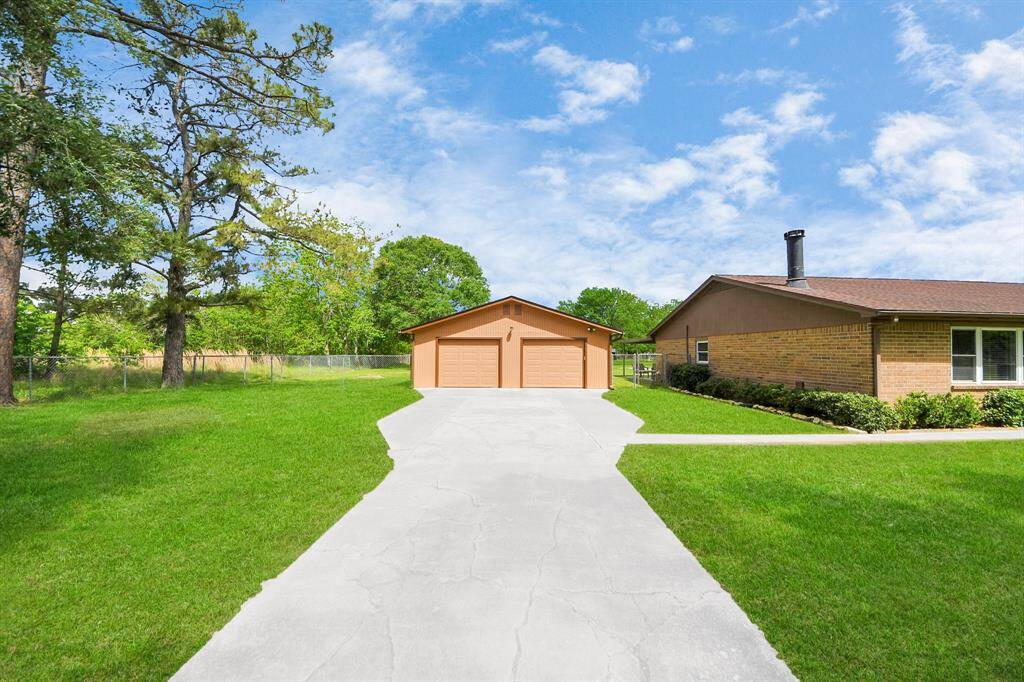 A massive 4+ car garage with endless possibilities—perfect for a dedicated mancave, utility vehicles, project cars, equipment, hobbies, and so much more!