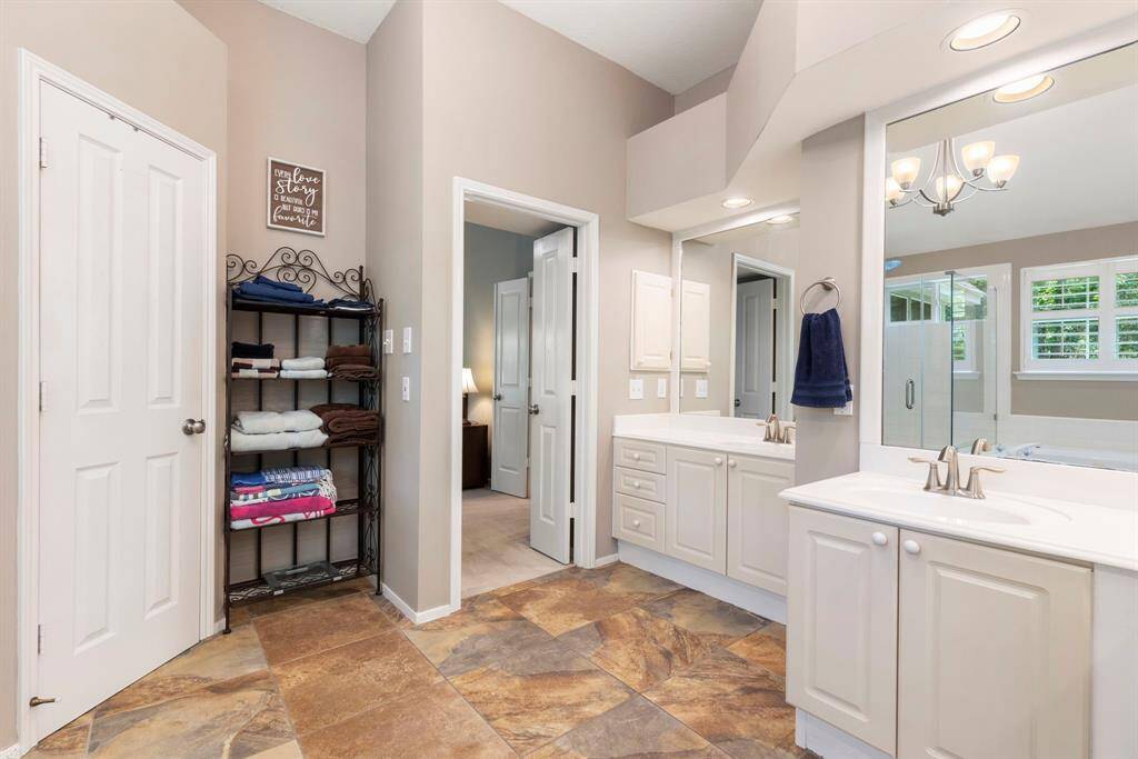 Separate tub and shower in this bright bathroom.