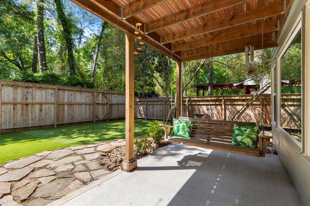 Covered patio in backyard. This house is set up for a portable gas generator. Makes it nice during difficult times.