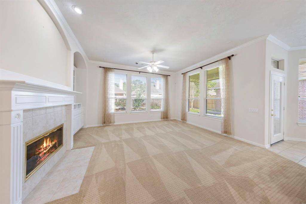 A cozy gas log fireplace adds warmth and charm, creating the perfect focal point for the family room.