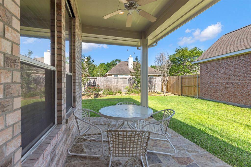 Relax and unwind on the covered back patio, ideal for enjoying the outdoors in any season.