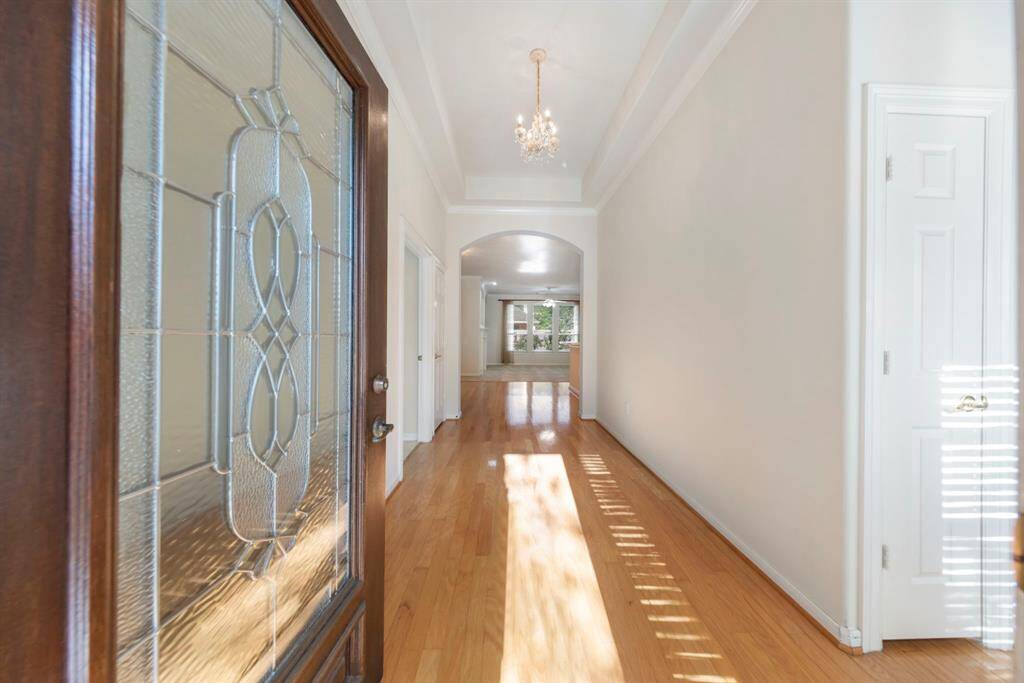 Step inside to discover high tray ceilings, beautiful wood flooring, and fresh, neutral paint throughout.