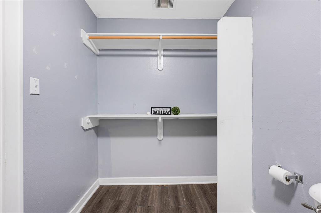 Access your clothes from your bathroom. Add a dresser for drawer space.