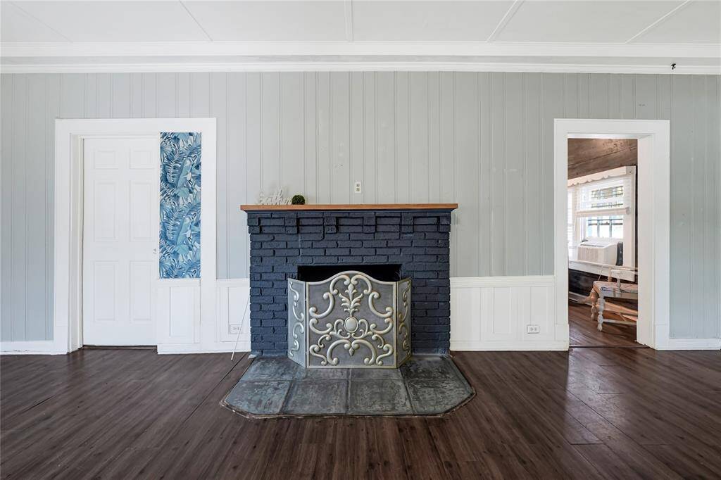 Living room with wood fireplace.