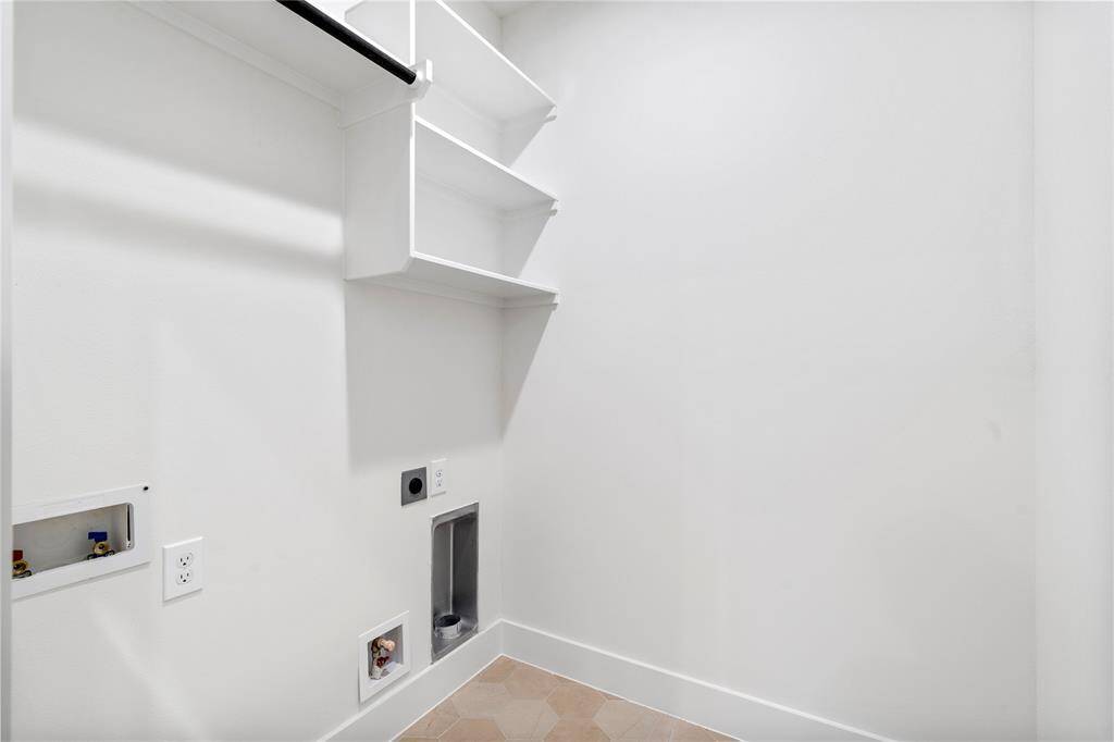 A well-designed laundry room offering both functionality and style on the second floor by the secondary bedrooms.
