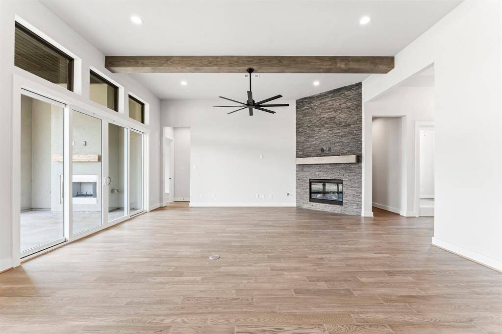 Gas-Log Fireplace, Modern Fan, and Floor Outlet at the Great Room
