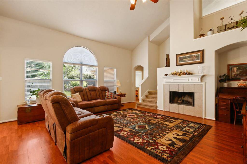 Warm living room featuring an elegantly designed fireplace.