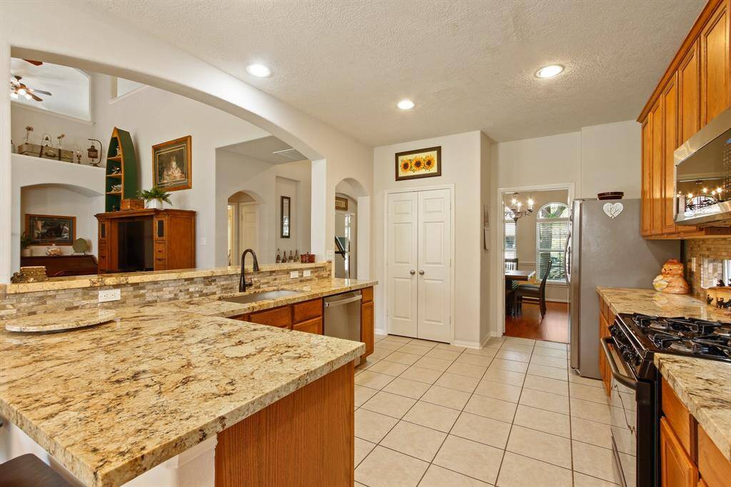 Granite counters add to the appeal of this gorgeous kitchen.