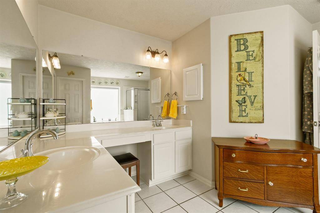 Spacious double vanity offers ample room for comfort and convenience.