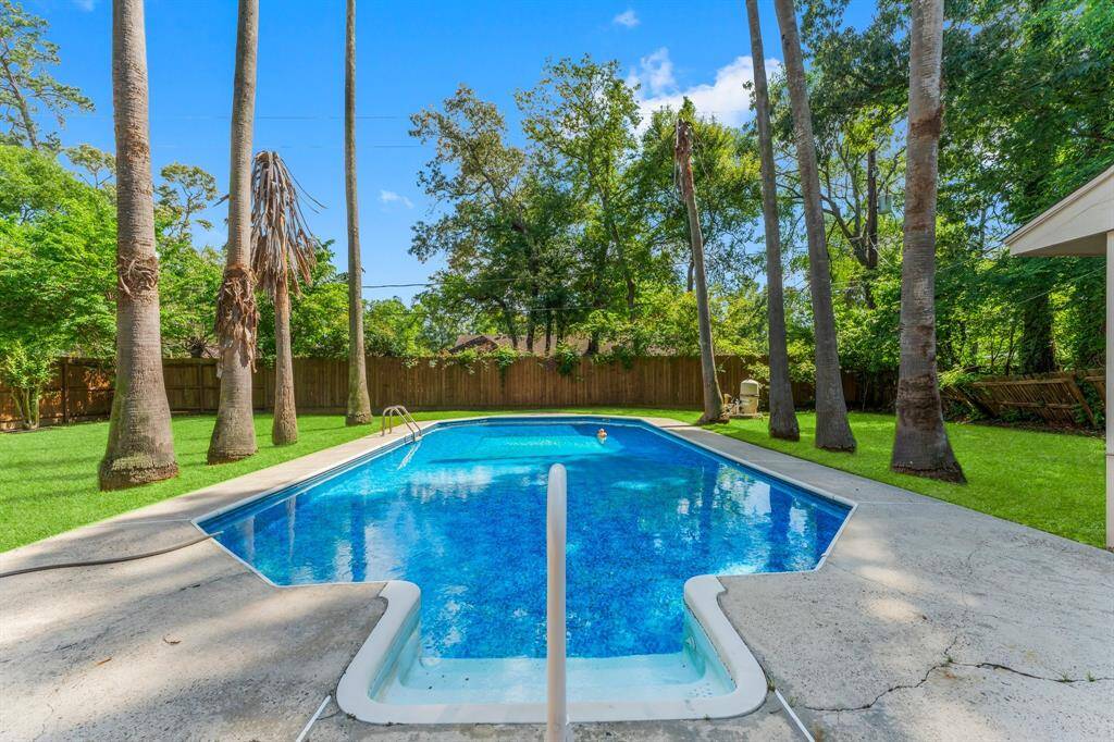 Stunning sparkling pool surrounded by mature trees!