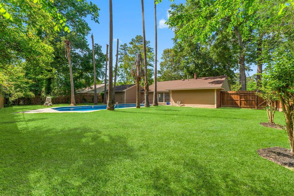 INCREDIBLE back yard is an outdoor oasis with endless options for gardening, growing fruit trees, whatever your heart desires!