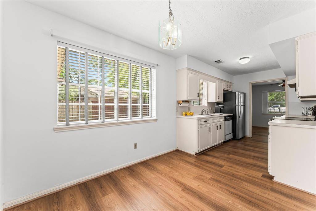 A picturesque kitchen nook offers back yard views.
