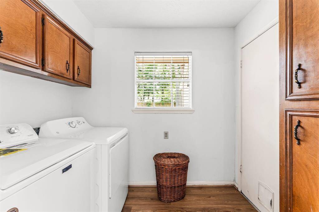 Large laundry room boasts plenty of storage space!