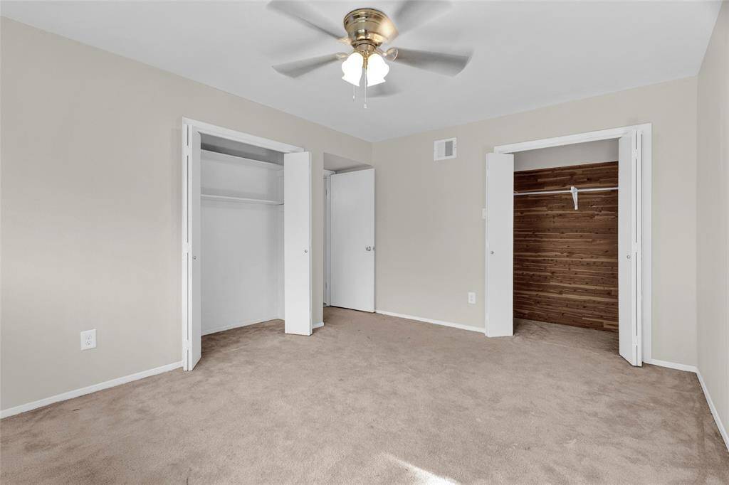 The spacious third bedroom offers versatility and style with two closets, one of which features a beautifully finished cedar interior—perfect for naturally protecting clothing and adding a touch of luxury.