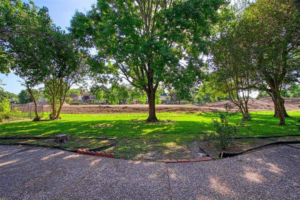 The expansive space beyond the property line is part of the Quail Valley Golf Course, providing future owners with the promise of lush fairways and scenic, open views once completed.