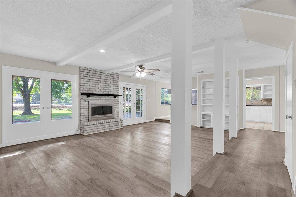 This bright and spacious living area is the heart of the home, blending classic charm with modern updates.