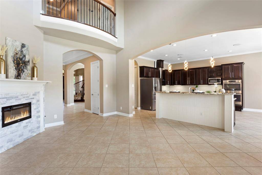 The open-concept living area flows seamlessly into the updated kitchen.