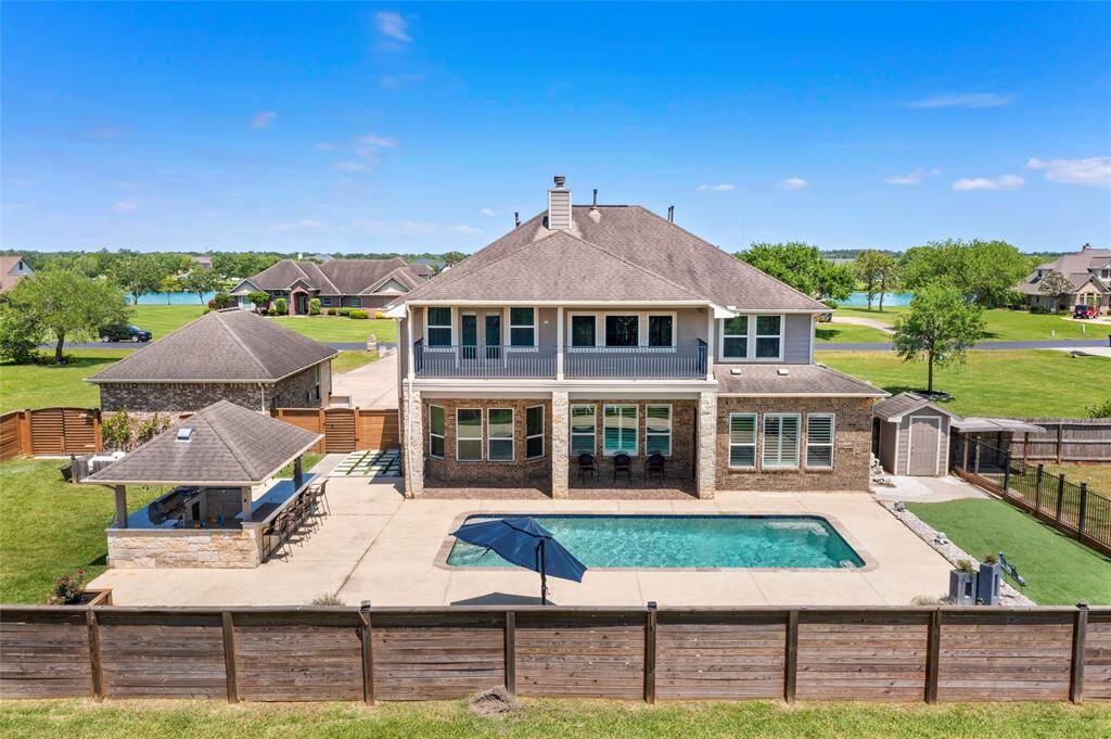 The property offers a scenic view of the neighborhood lake, providing a peaceful setting.