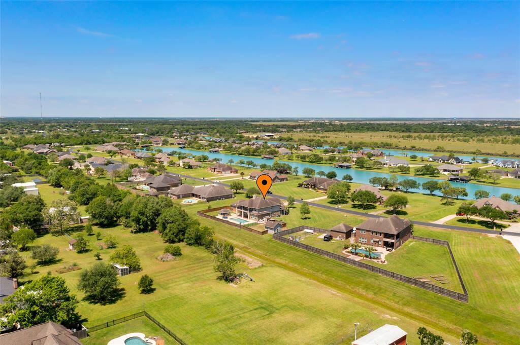 Enjoy water views in the front and no back neighbors in the beautiful neighborhood of Lago Santa Fe.