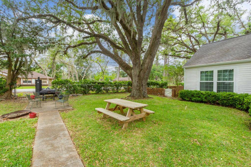 Spacious yard with mature trees