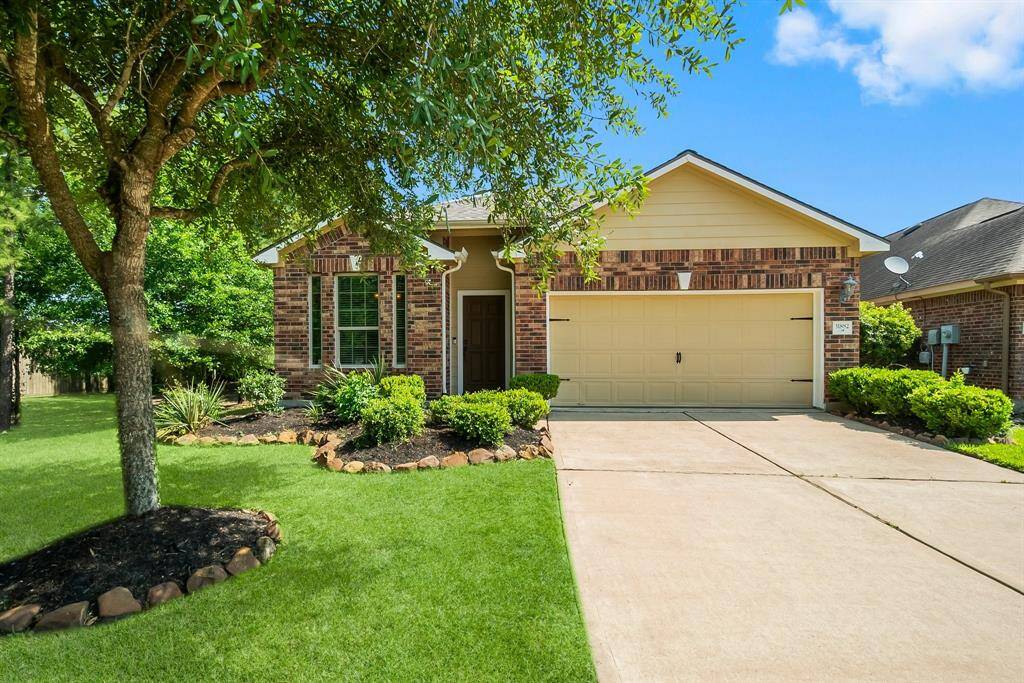 Charming single-story brick home with a two-car garage and well-maintained landscaping. Features a lush front lawn, mature trees, new roof and inviting curb appeal.