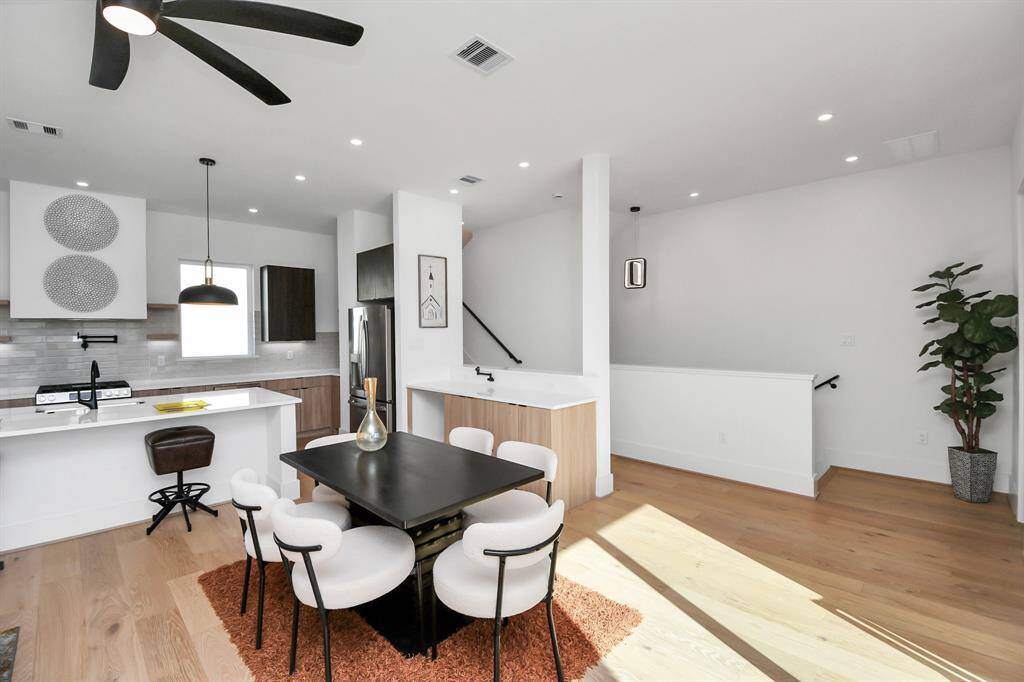 A sleek built-in serving area with additional storage adds convenience and enhances the space’s functionality.